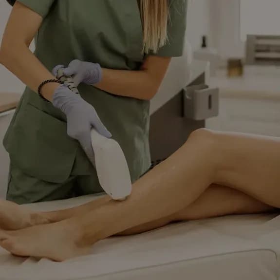 A laser handpiece in use during a hair removal treatment
