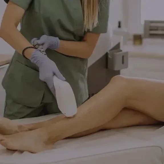 A laser handpiece in use during a treatment