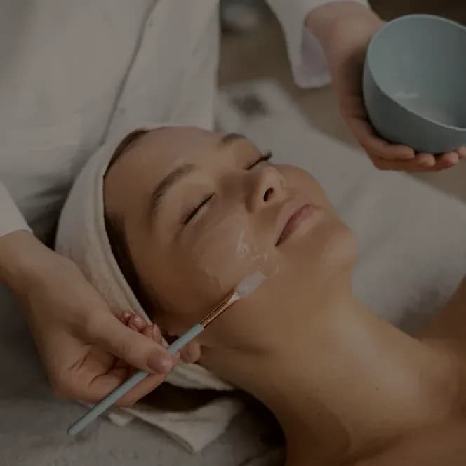A chemical peel being applied with a brush